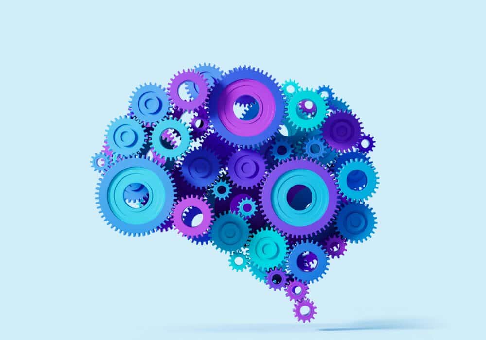 Colorful gears forming a brain shape