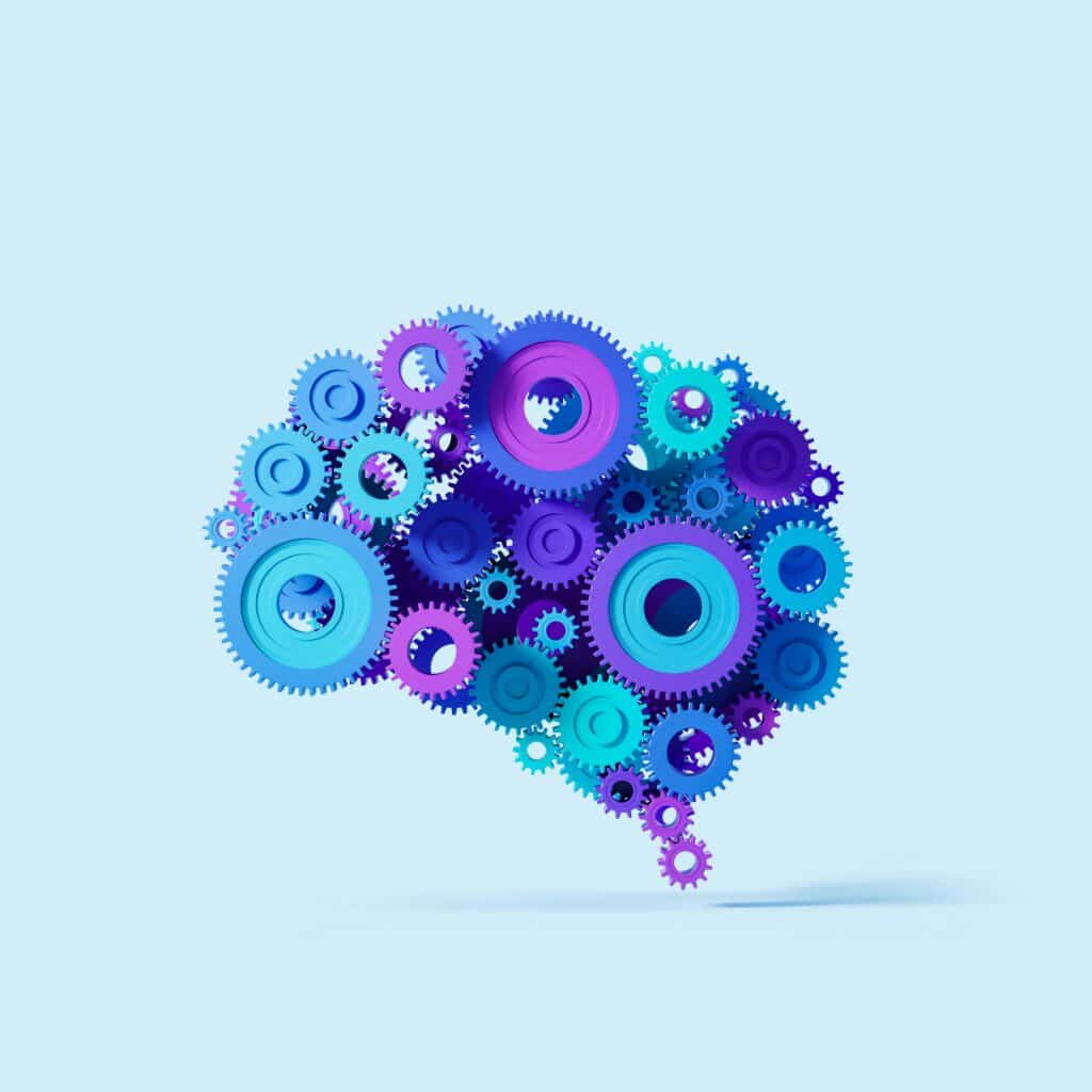 Colorful gears forming a brain shape